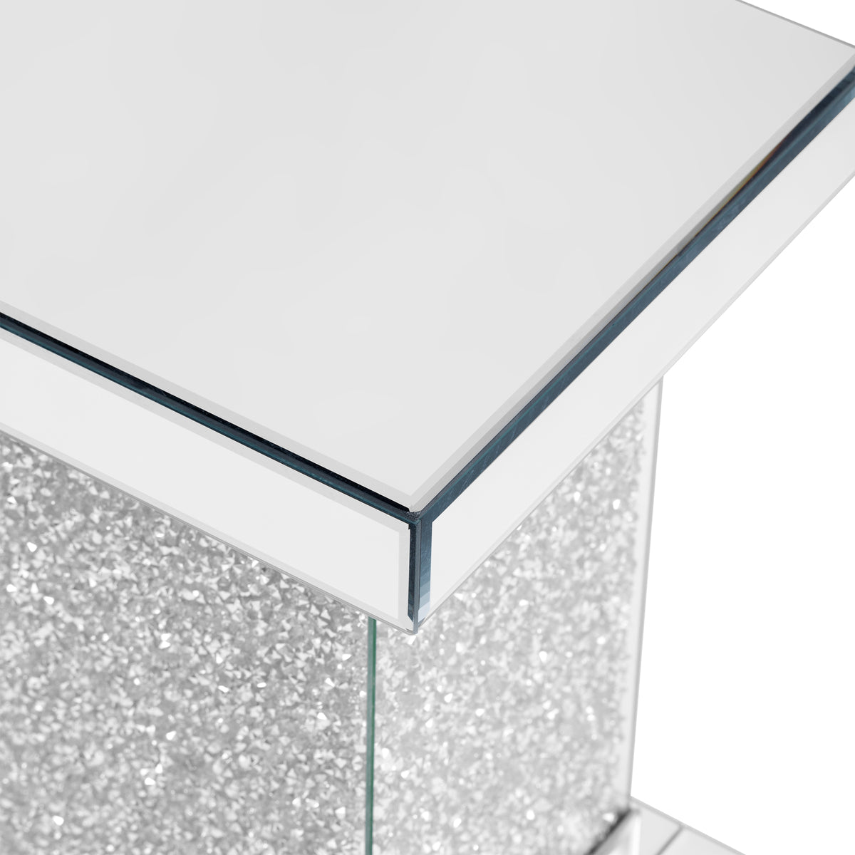 Close-up of the silver glass tabletop edge on a square mirror coffee table