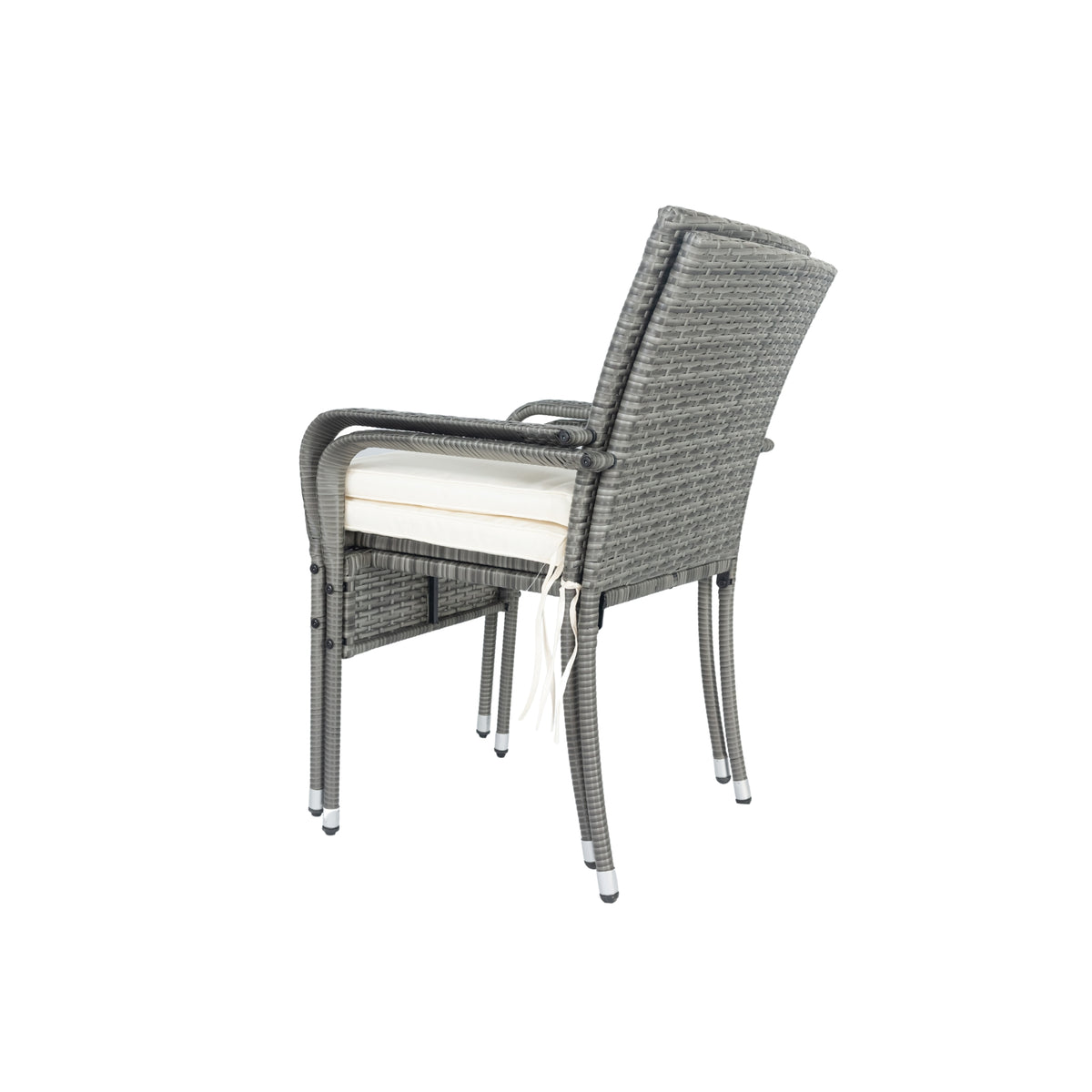 Grey wicker patio armchair with white seat cushion and curved metal legs.