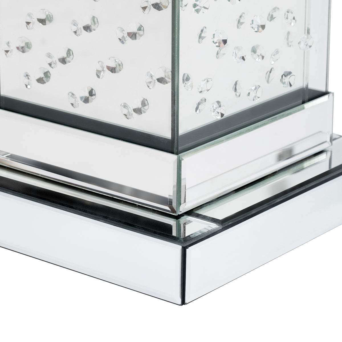 Square mirrored side table base with chrome trim and stacked clear glass shelves.