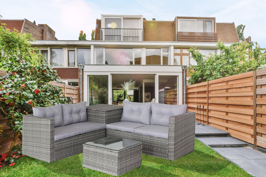 Grey outdoor sectional sofa set with white cushions and square storage coffee table