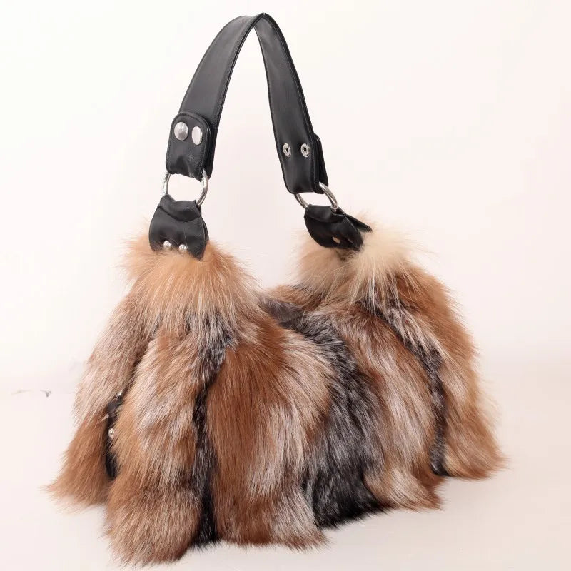 Brown and cream faux fur shoulder bag with black leather strap and metal buckles