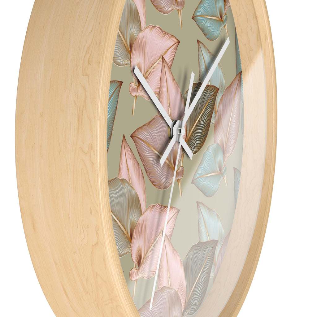 Wood wall clock close-up: leaf-pattern face with white clock hands