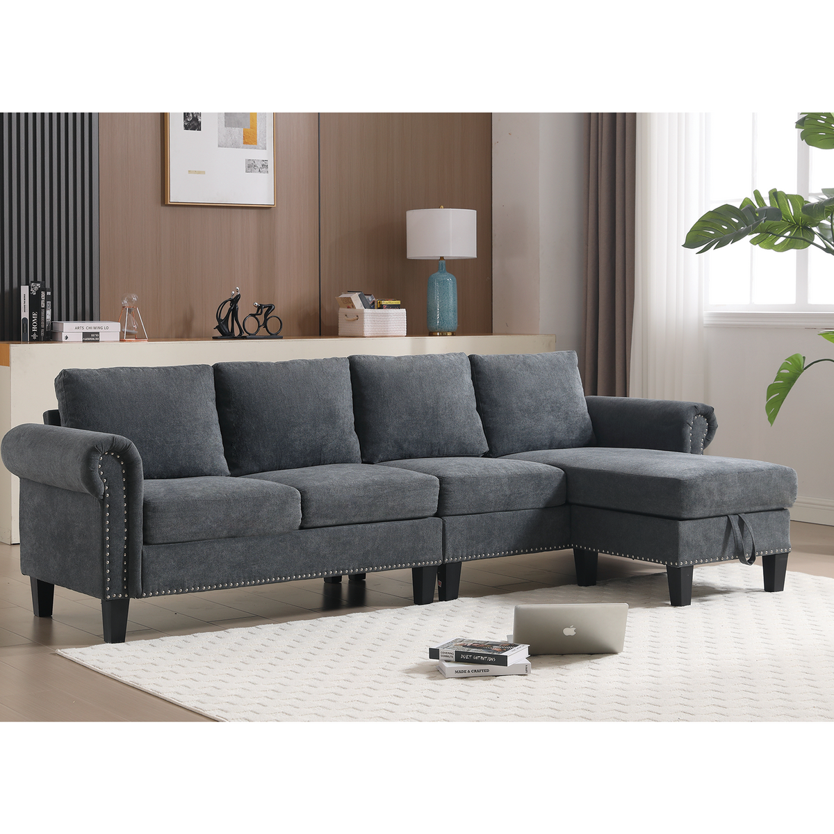Gray L-shaped sectional sofa with storage ottoman, cushioned seats and nailhead trim