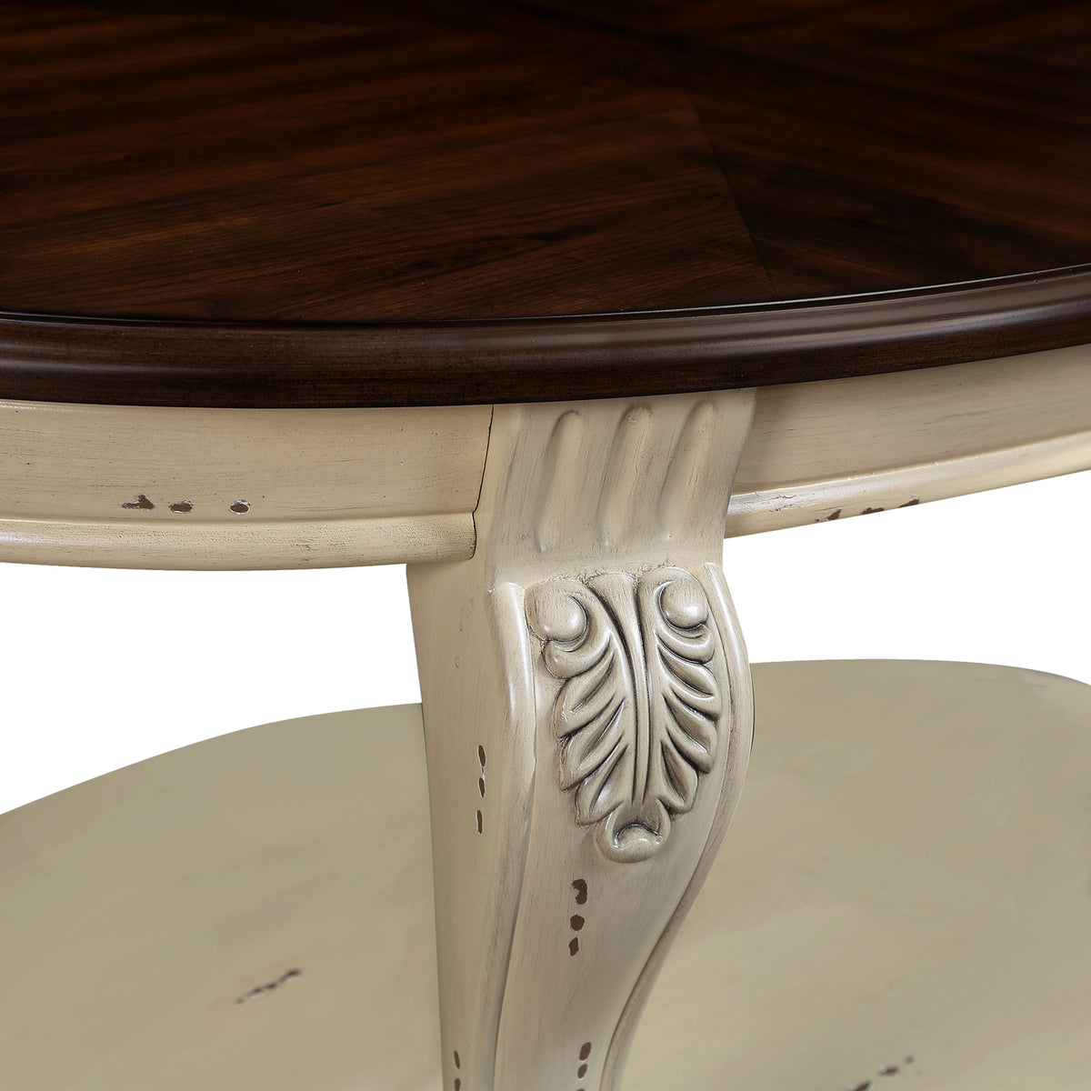 Antique white carved pedestal base under oval coffee table