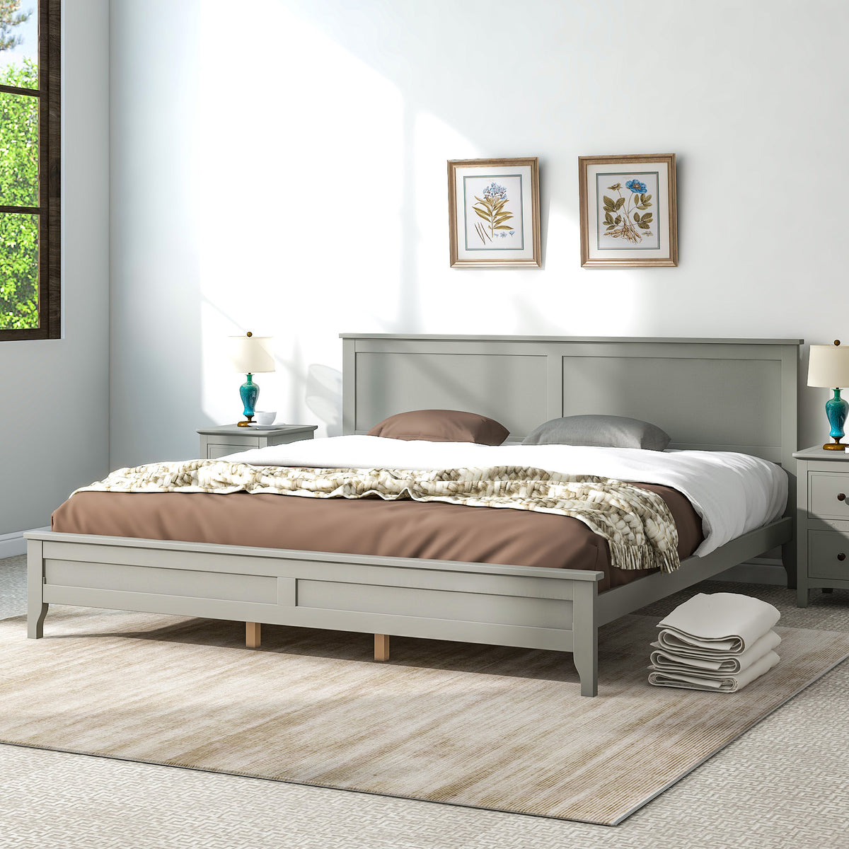 Gray king platform bed in bedroom with paneled headboard and slatted mattress base