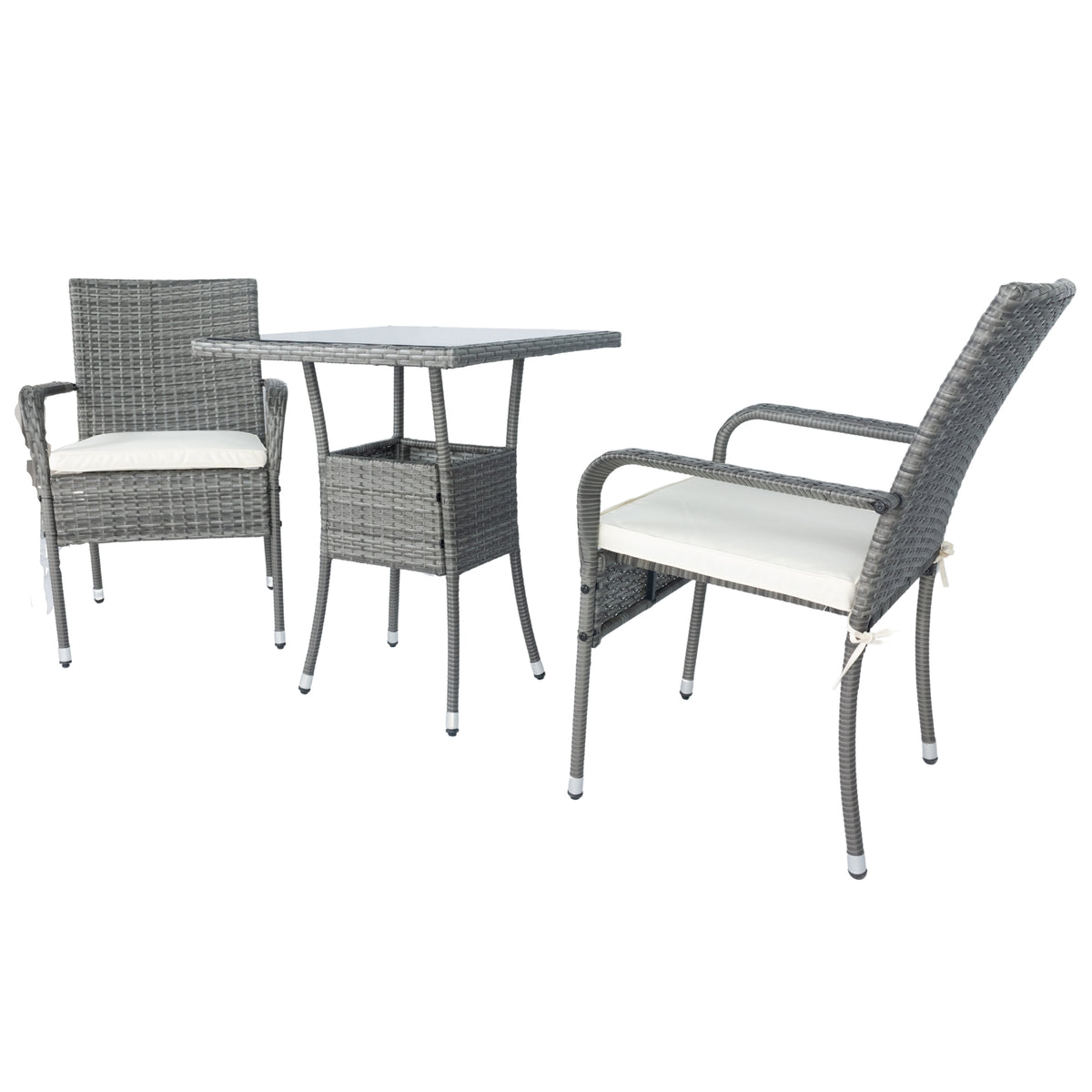 Grey wicker patio set with two armchairs, white cushions, and glass-top table from side angle