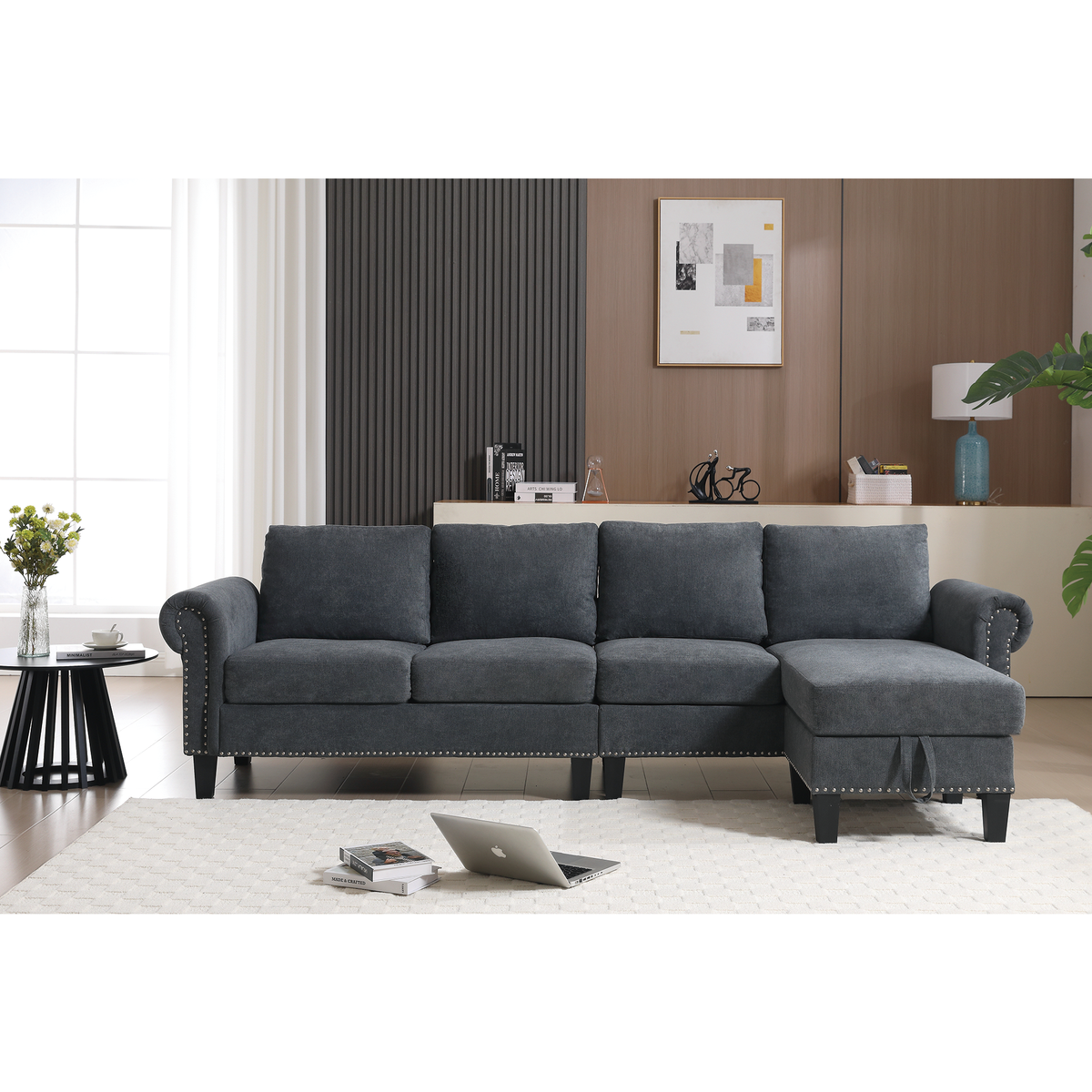 Gray sectional sofa with chaise and storage ottoman, tufted arms and nailhead trim