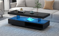Black LED coffee table with blue LED-lit storage shelf, two drawers, and top decor