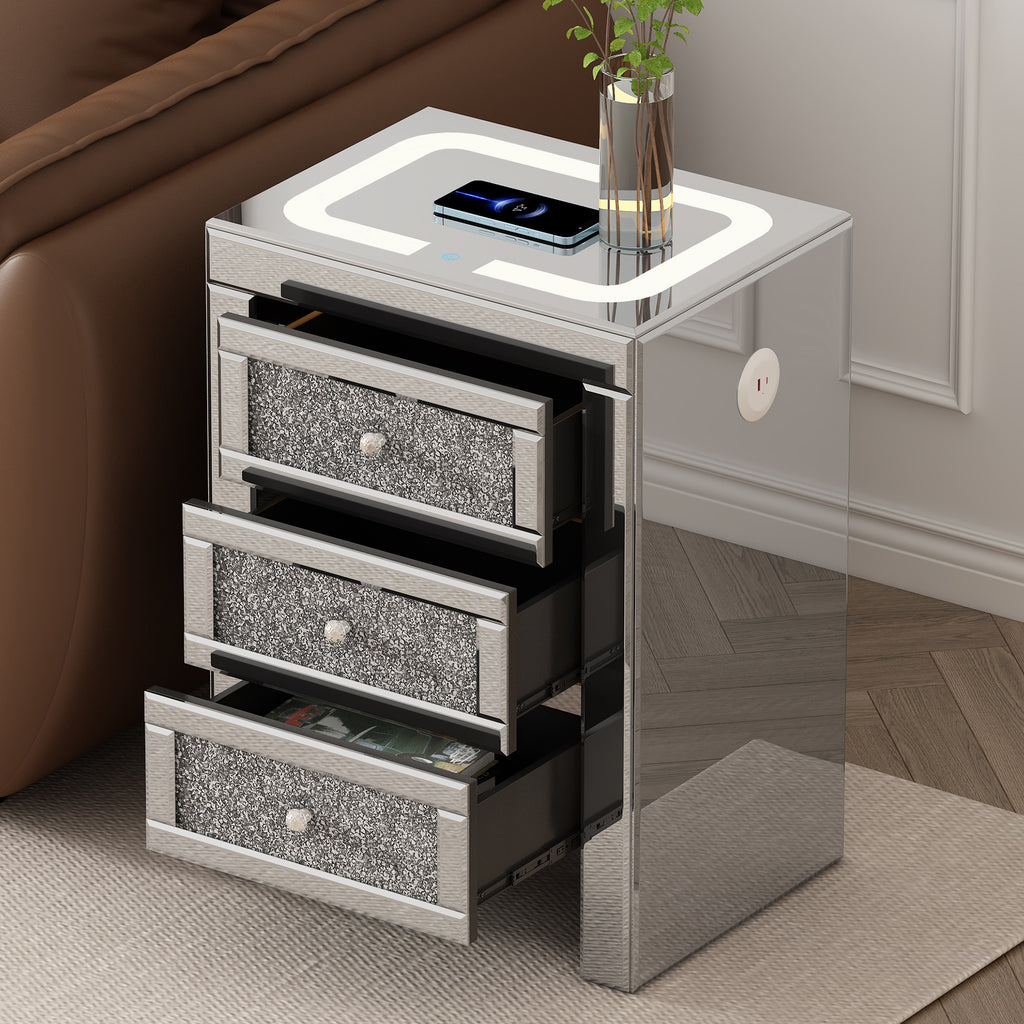Silver coffee table with open drawers exposing black interior compartments and charging top