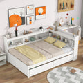 White bed frame with L-shaped bookcase shelves and drawers; slatted mattress base
