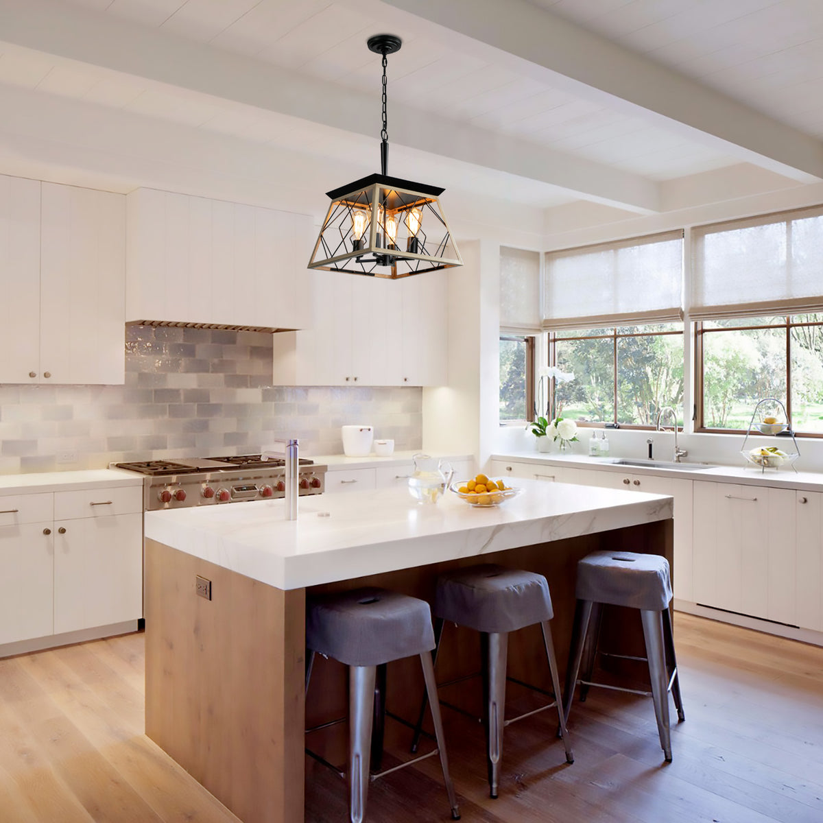 Black 4-light farmhouse chandelier centered in kitchen, wire cage shade and chain.