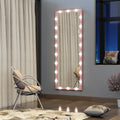 Pink illuminated full body mirror with bulb border on a wall in a living space