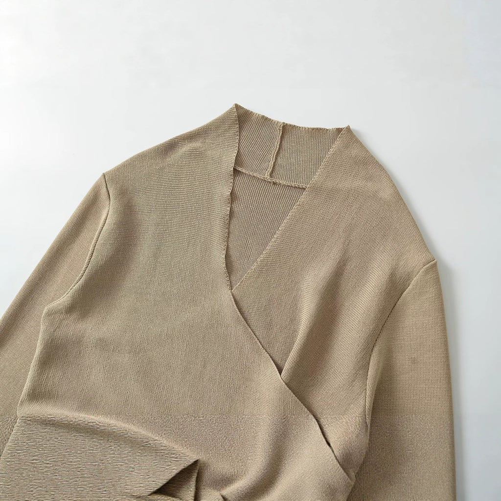 Khaki V-neck knit sweater detail with wrap overlap and ribbed collar
