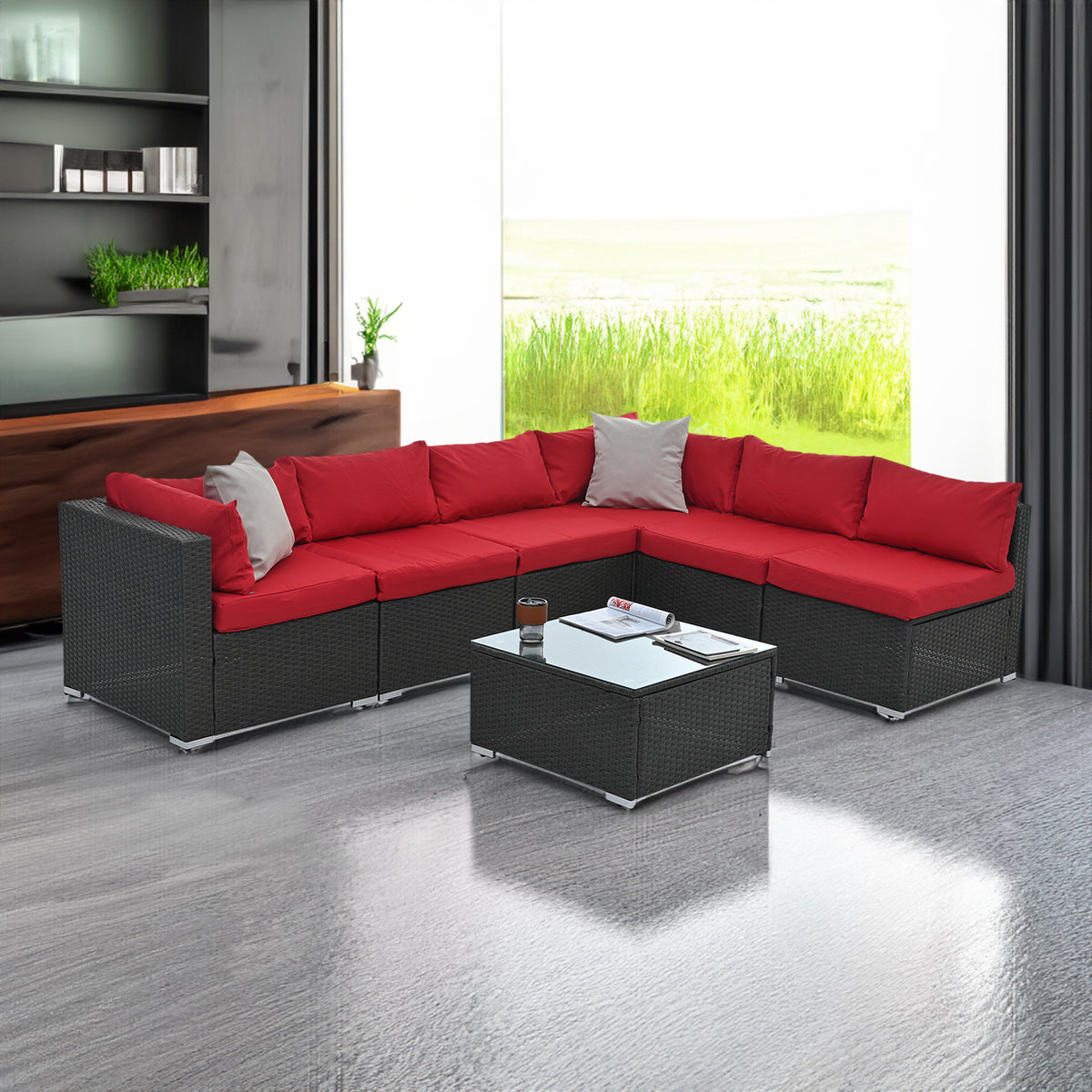 Dark gray woven outdoor corner sofa set with red seat cushions and matching coffee table