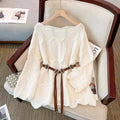 Women’s white one-shoulder pullover sweater with textured knit and beaded tassel tie