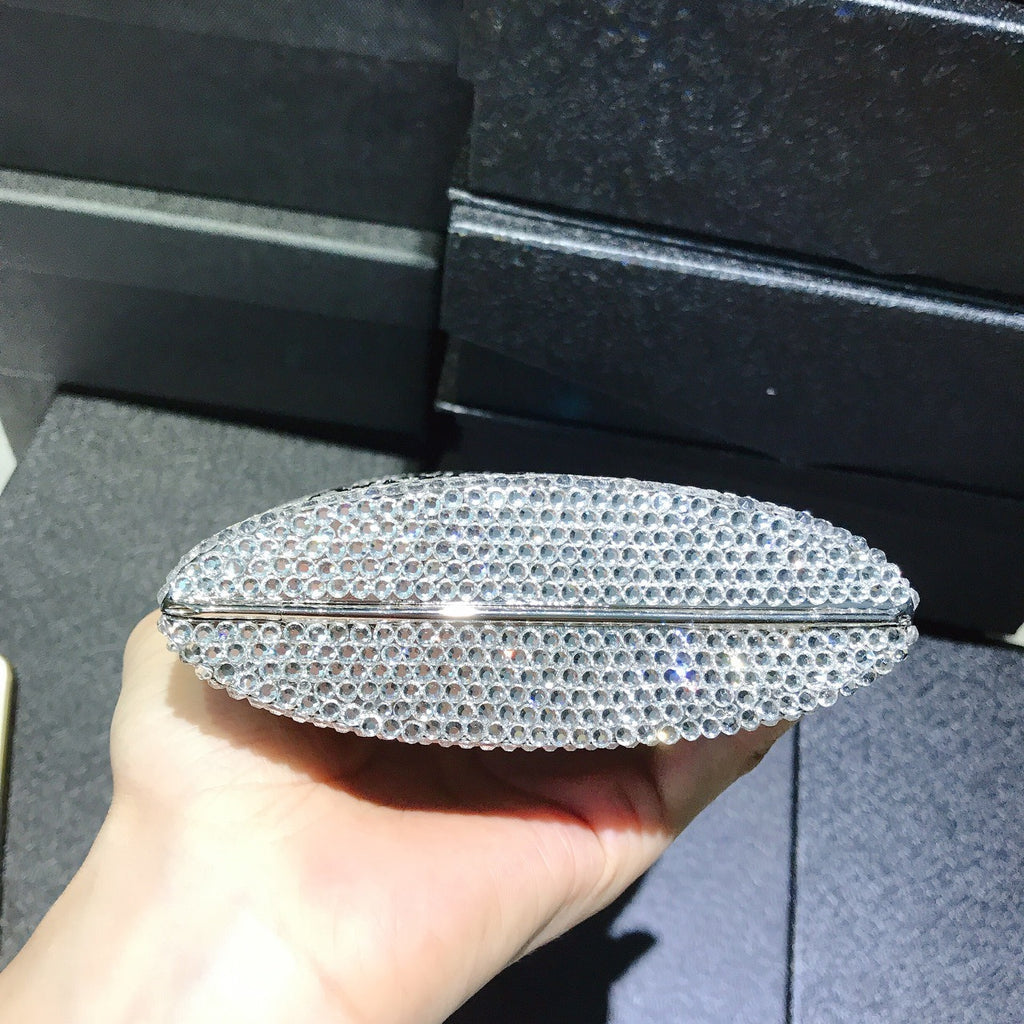 Rhinestone silver mini bag, top view with rounded clamshell silhouette