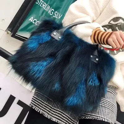 Blue faux fur handbag with black leather straps and silver snap hardware