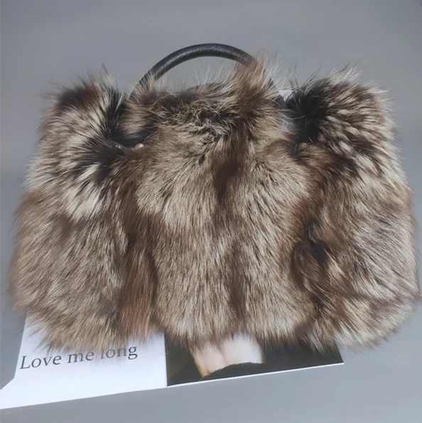 Fox fur handbag with leather handle, brown and gray striped fur
