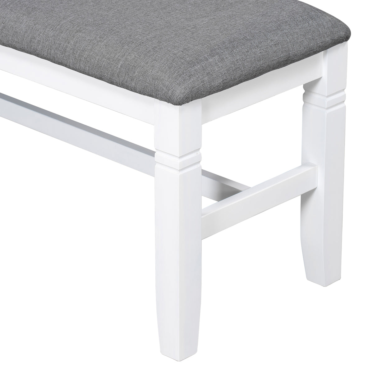 Upholstered bench corner with dark gray seat and white turned legs
