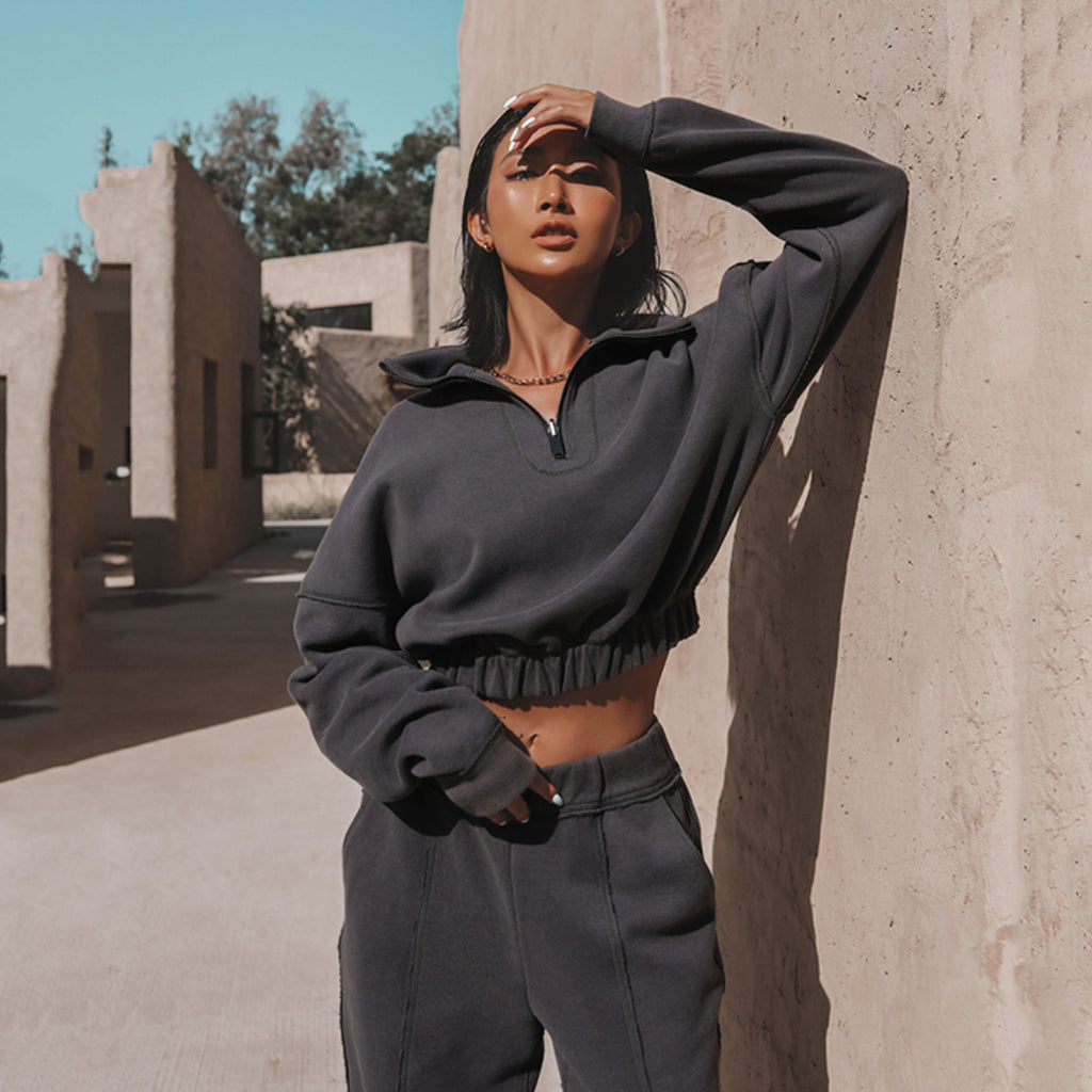 Charcoal half-zip sports hoodie and jogger set with elastic hem and matching waistband