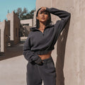 Charcoal half-zip sports hoodie and jogger set with elastic hem and matching waistband
