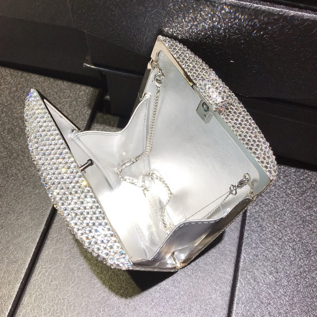 Silver rhinestone handbag with chain strap, open-top frame and letter panel