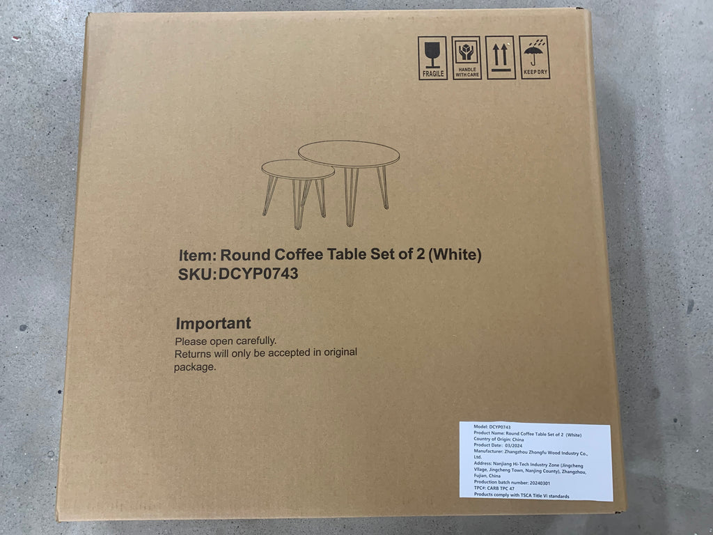 Round coffee table set of 2 (white) on cardboard shipping box