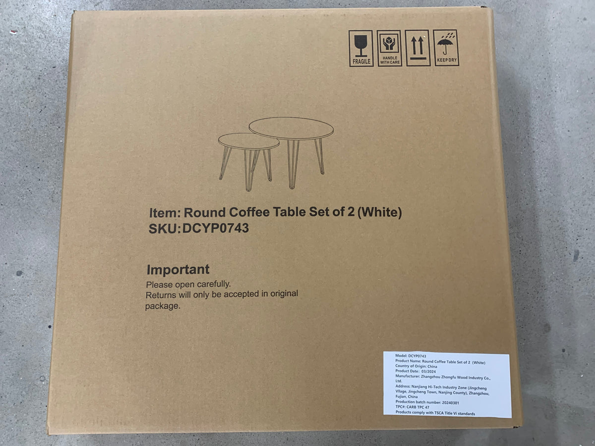 Round coffee table set of 2 (white) on cardboard shipping box