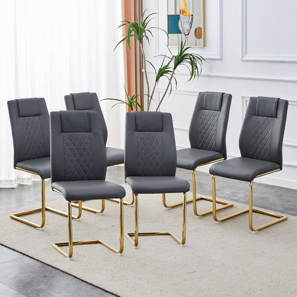 Set of gray faux leather accent chairs with diamond-stitch panels and gold metal legs