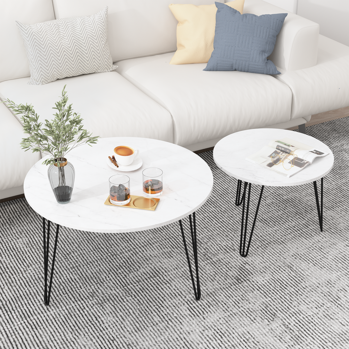 Round nesting coffee table set of 2 with white tops and black metal tripod legs