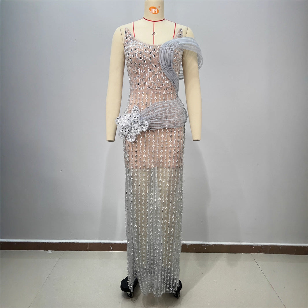 Silver sequined strapless evening dress with draped tulle sleeve and flower detail
