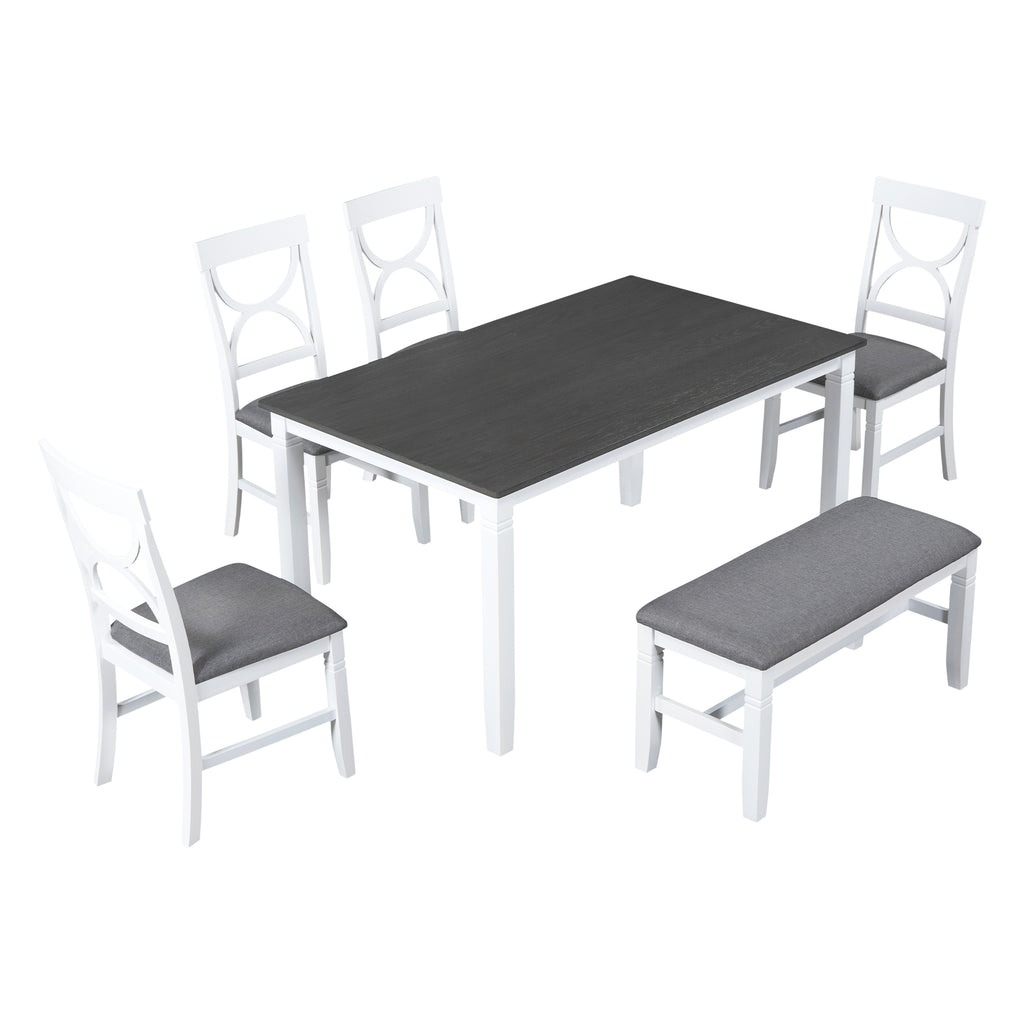 Dining set corner view with dark gray table, gray bench, and white chairs