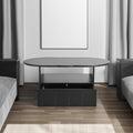 Black round coffee table with storage drawer doors and caster wheels