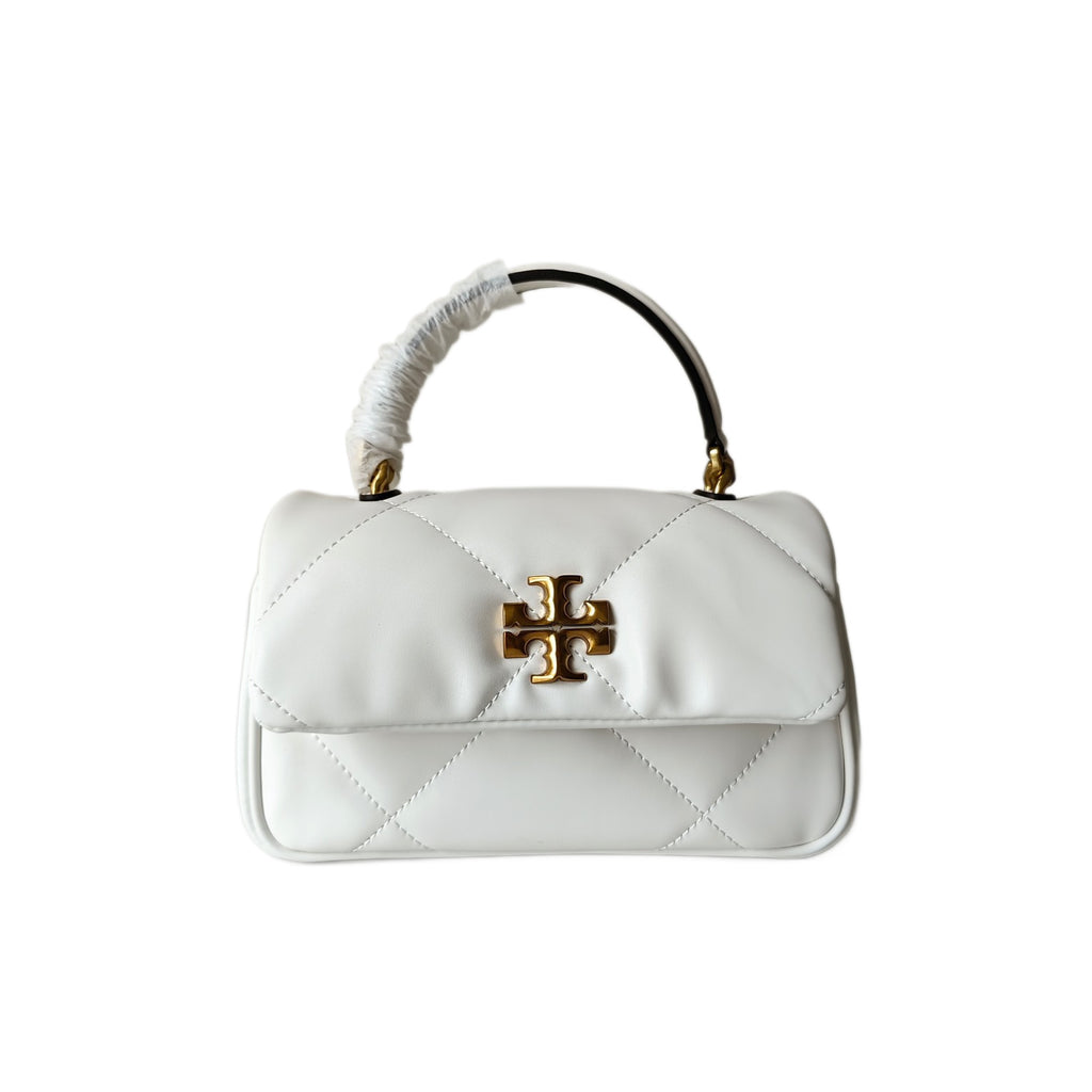 White quilted crossbody bag with gold logo clasp and ruched top handle, front view