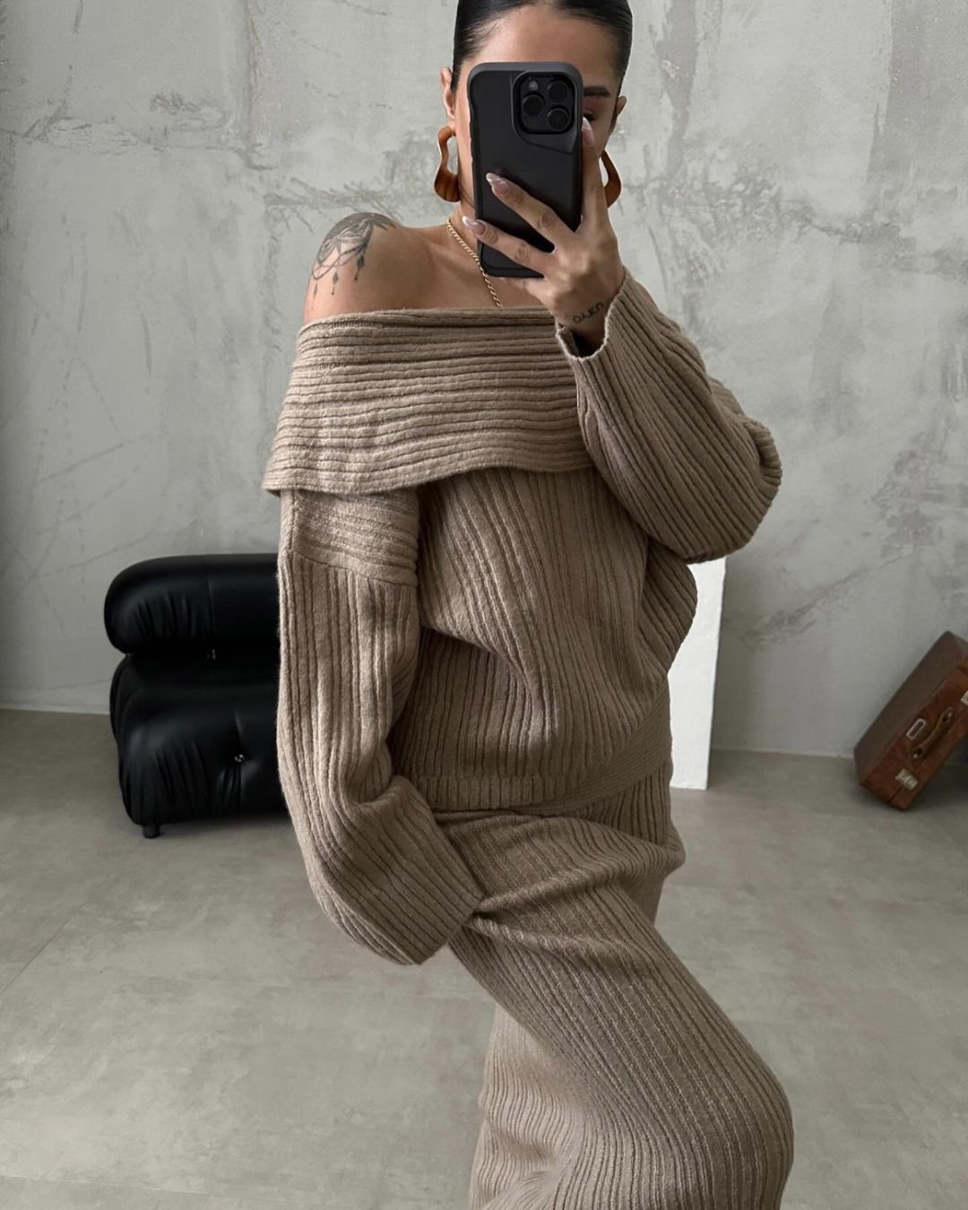 Beige off-shoulder ribbed knit sweater with matching long knit skirt set