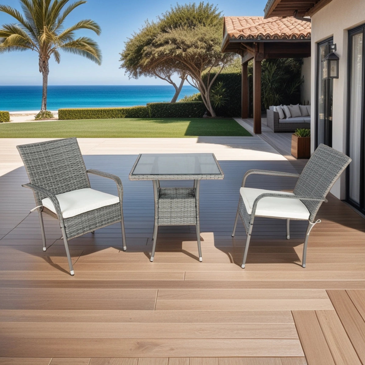 Grey wicker patio conversation set with white cushions and square glass-top table, two chairs.