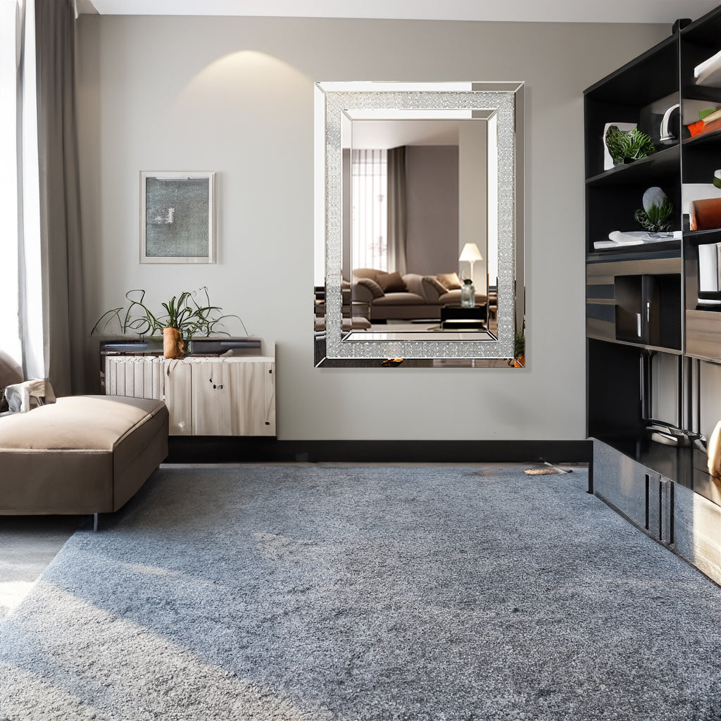 Silver rectangular wall mirror with textured frame and reflective glass
