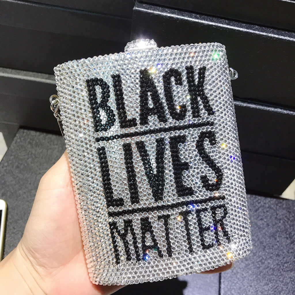 Rhinestone mini dinner bag in hand, “BLACK LIVES MATTER” front panel