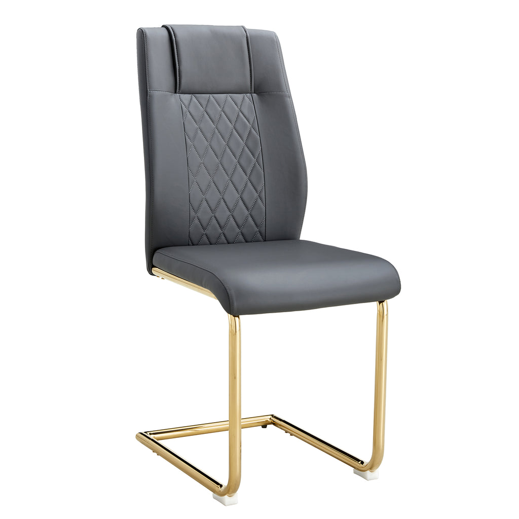 Gray faux leather accent chair with quilted back, cushioned seat, and gold metal sled legs.