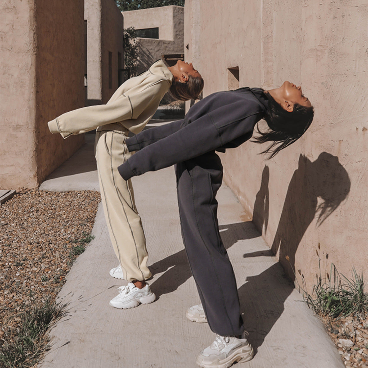 Dark charcoal quarter-zip hoodie and matching jogger pants set with ribbed cuffs